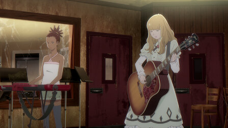 Cena do anime Carole & Tuesday com legendas em português e inglês.